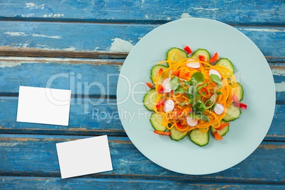 Bussiness cards on blue wooden desk with food 3d
