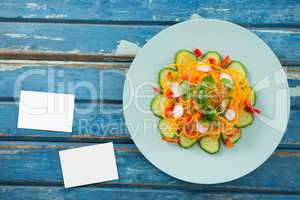 Bussiness cards on blue wooden desk with food 3d