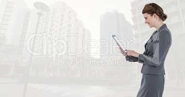 businesswoman with tablet  in cityscape