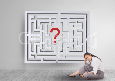 Woman sitting on the floor with a 3d maze behind