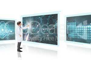 Man doctor interacting with 3d medical interfaces against white background