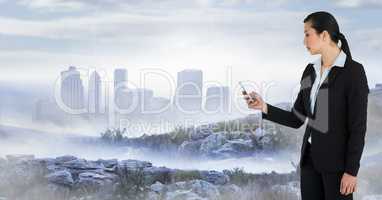 businesswoman with phone in cityscape