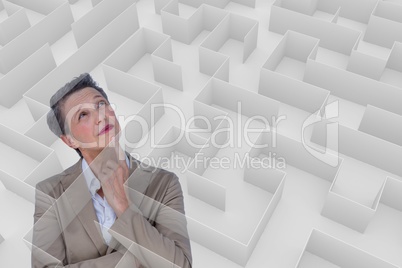 Woman thinking behind a 3d maze