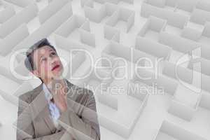 Woman thinking behind a 3d maze