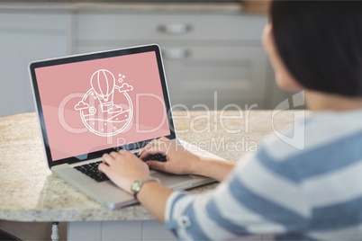Woman using a computer with travel icon on the screen