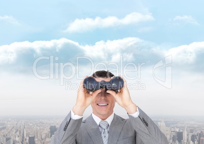 Happy man looking through binoculars against city background