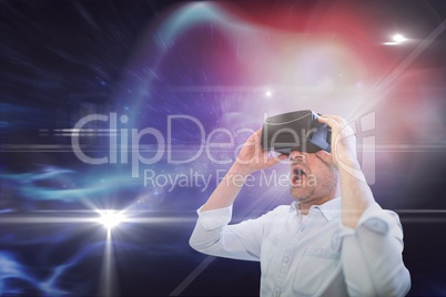 Surprised man in VR headset looking to a red, purple and black galaxy background
