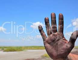 right man's hand on a background of a landscape