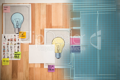 Composite 3d image of light bulb charts attached on wooden wall