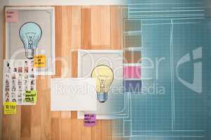 Composite 3d image of light bulb charts attached on wooden wall