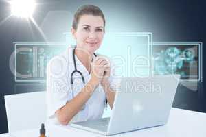Composite 3d image of confident female doctor with laptop on table