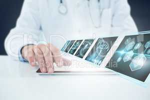 Composite 3d image of doctor using digital tablet against white background