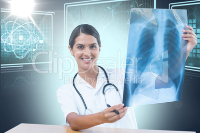 Composite 3d image of female doctor examining chest x-ray