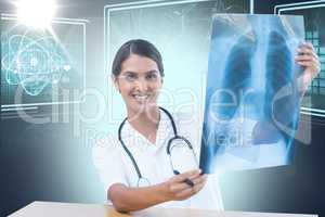 Composite 3d image of female doctor examining chest x-ray