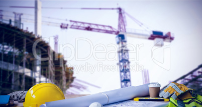 Composite image of panoramic shot of architecture equipment on table