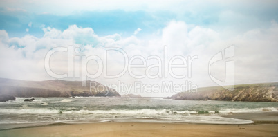 View of beach against cloudy sky