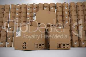 Composite image of pile of brown cardboard boxes