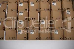 Composite image of full frame shot of cardboard boxes