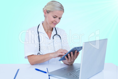 Composite 3d image of female doctor using digital tablet