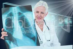 Composite 3d image of portrait of smiling female doctor examining chest x-ray