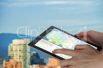 Composite 3d image of close-up of businesswoman holding digital tablet