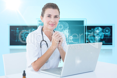 Composite 3d image of confident female doctor with laptop on table