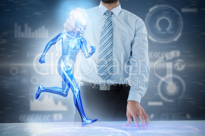 Composite 3d image of midsection of businessman touching invisible screen at desk
