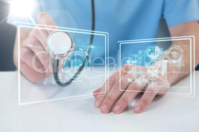 Composite 3d image of midsection of surgeon holding stethoscope