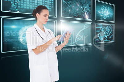 Composite 3d image of pretty nurse using tablet pc
