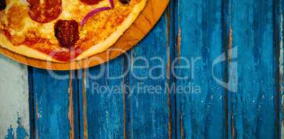 Pizza on blue wooden table