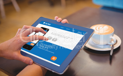 Close-up of digital 3d tablet and coffee on table