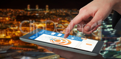 Composite 3d image of businesswoman hand using digital tablet