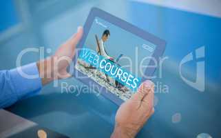 Composite 3d image of businessman using his tablet