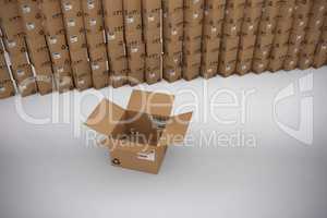 Composite image of empty cardboard box by stack of boxes