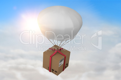 Composite image of 3d composite image of parachute carrying cardboard box