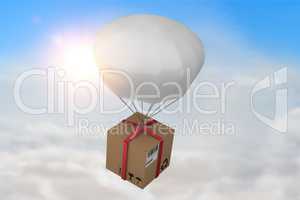 Composite image of 3d composite image of parachute carrying cardboard box
