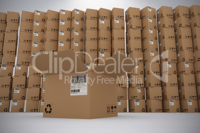 Composite image of open cardboard box against pile of boxes