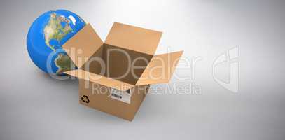 Composite image of 3d image of globe by empty cardboard box