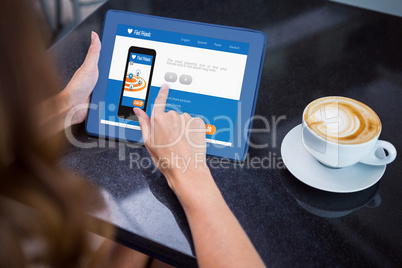 Woman having coffee and using her 3d tablet