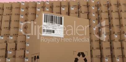 Composite image of recycle icon and barcode on packed cardboard box