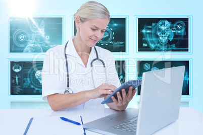 Composite 3d image of female doctor using digital tablet