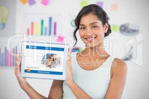 Happy businesswoman showing digital 3d tablet in creative office