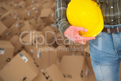 Composite 3d image of manual worker holding helmet