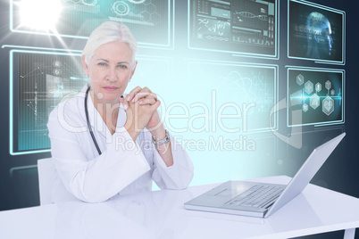 Composite 3d image of portrait of confident female doctor with laptop on desk