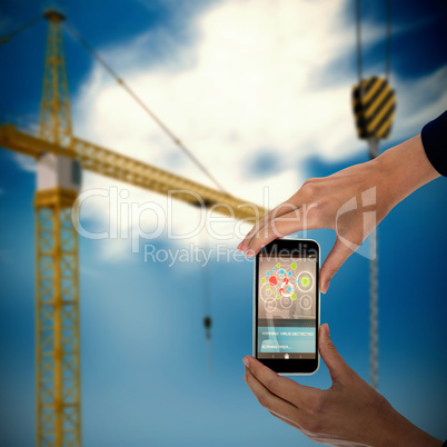 Composite 3d image of cropped hands of businesswoman holding mobile phone