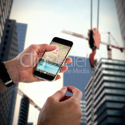 Composite 3d image of close-up of man holding mobile phone