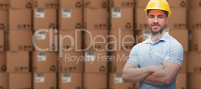 Composite image of worker wearing hard hat in warehouse