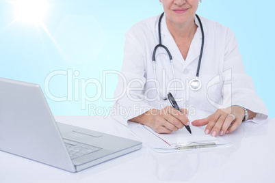 Composite 3d image of midsection of female docotor writing prescription at desk