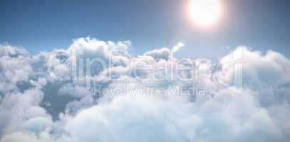 Idyllic view of bright sun over clouds during sunny day