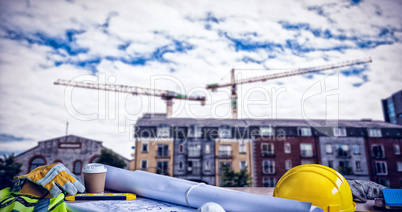 Composite image of panoramic shot of architecture equipment on table